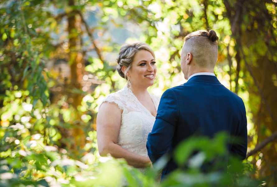 bride and groom in the woods